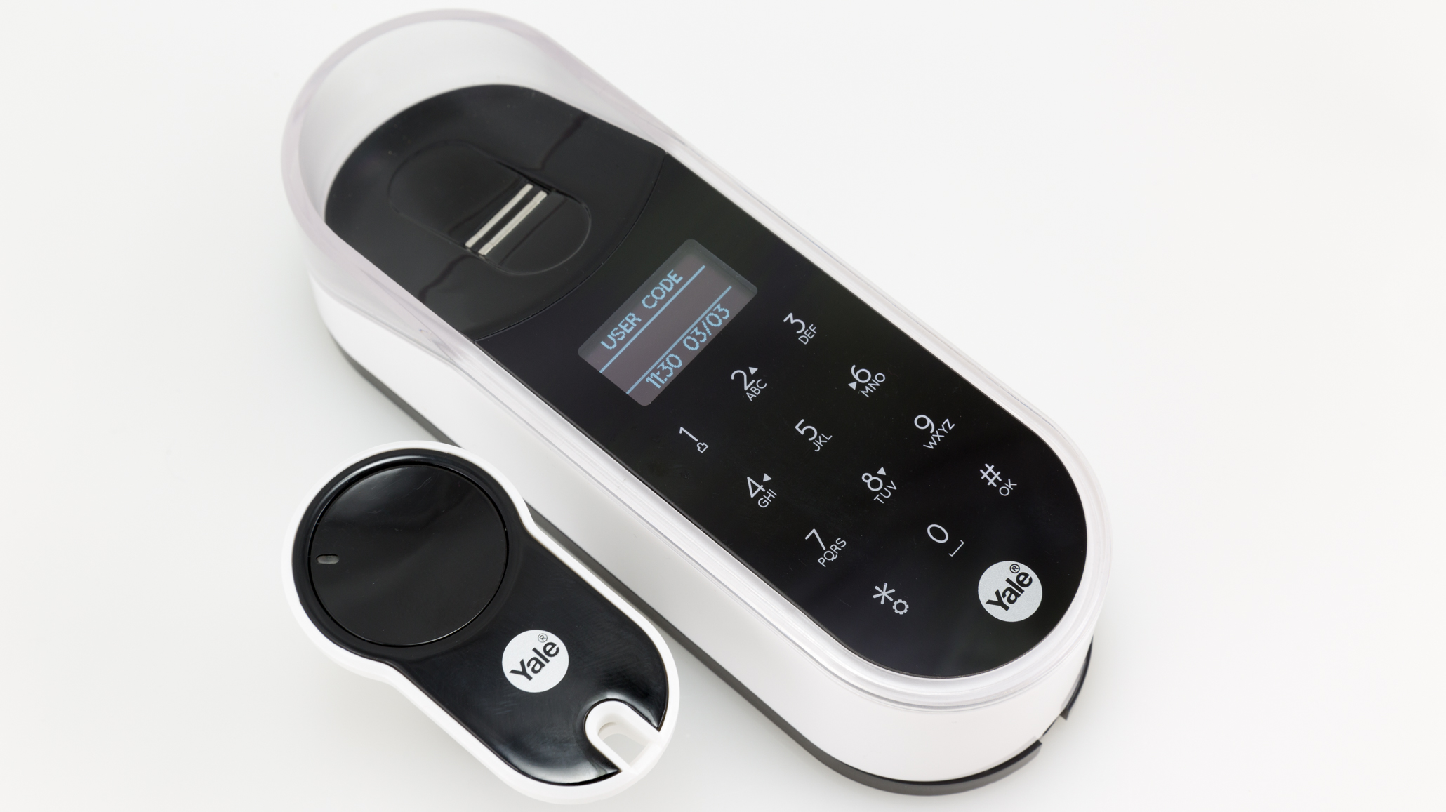The compact ENTR remote control (left) is designed to snap onto a key ring, while the fingerprint reader (right) offers the expected biometric feature as well as a keypad for PIN code entry. Image: Digitized House Media.