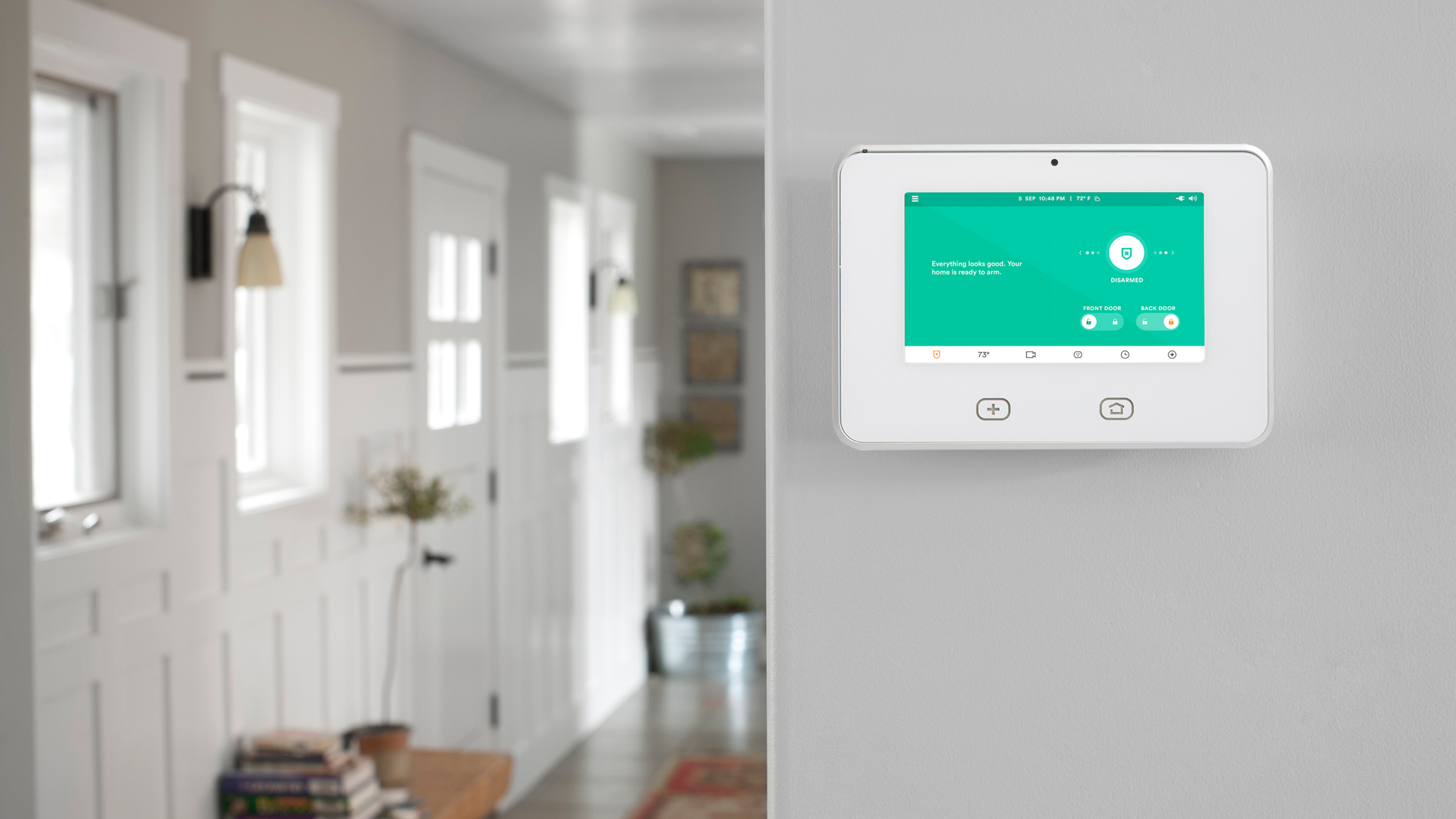 Central home automation control systems can take the form of smartphone apps or dedicated wall-mounted panels. In this Vivint-equipped home, the company's SkyControl Panel integrates multiple safety, security, and convenience features. Image: Vivint.