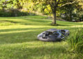 Robotic mowers can be a big time saver in your landscape, giving you more time to tend to the garden. Image: Husqvarna.