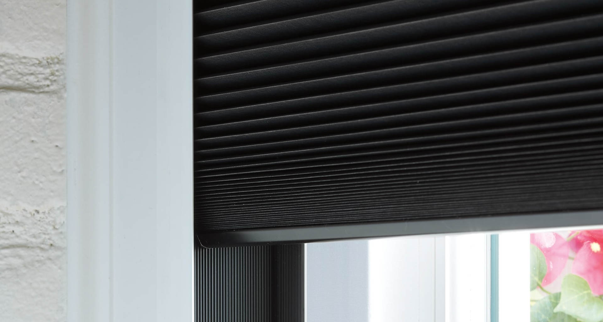 Window shades can help modulate the incoming natural light in your office space. By adding automation, shades like these can open and close during the day to optimize lighting and save on energy. Image: Hunter Douglas.