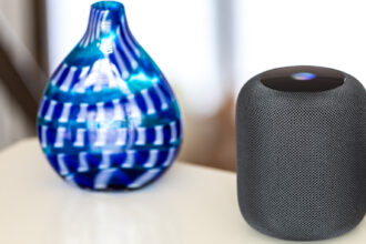 Apple HomePod and blue vase