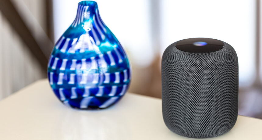 Apple HomePod and blue vase
