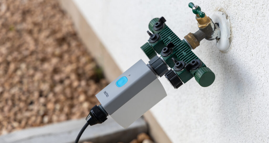 Here, the Rachio Smart Hose Timer is connected to a drip irrigation system to water plants on a patio. 